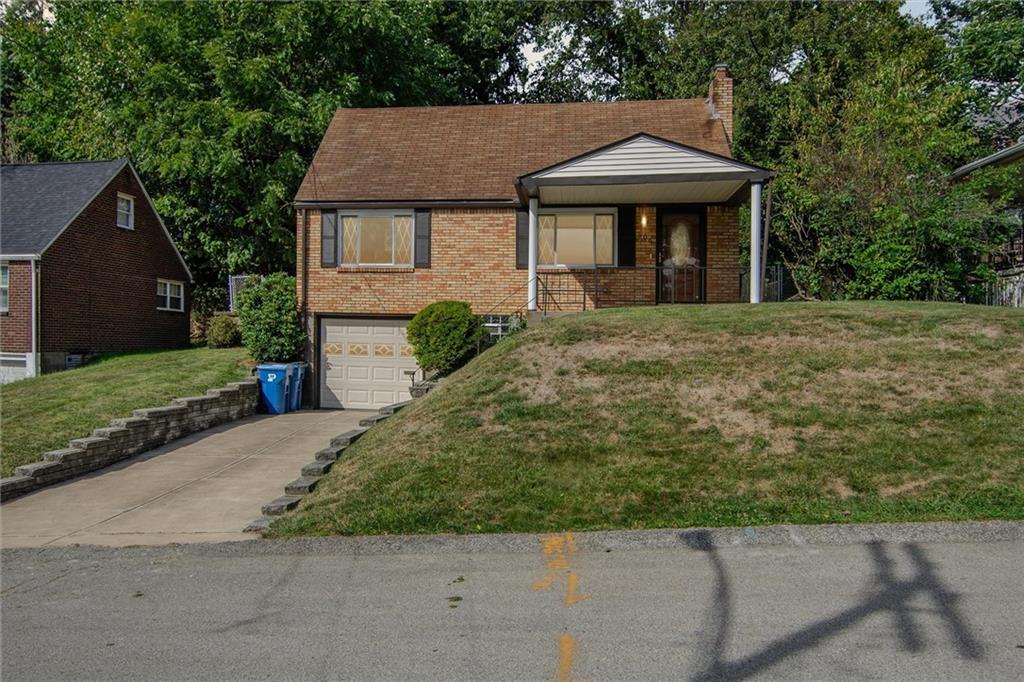 a front view of a house with yard