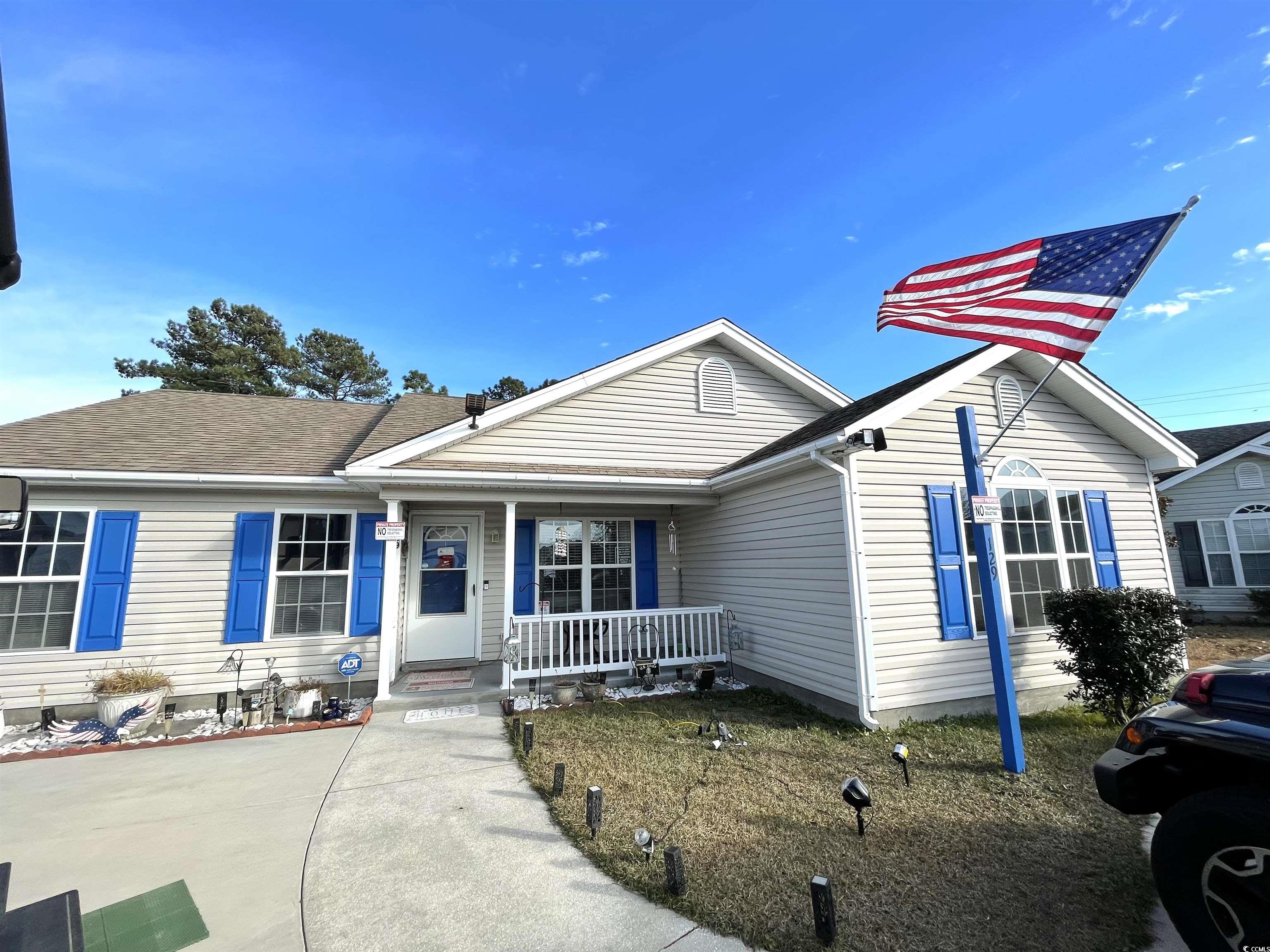 View of front facade featuring covered porch