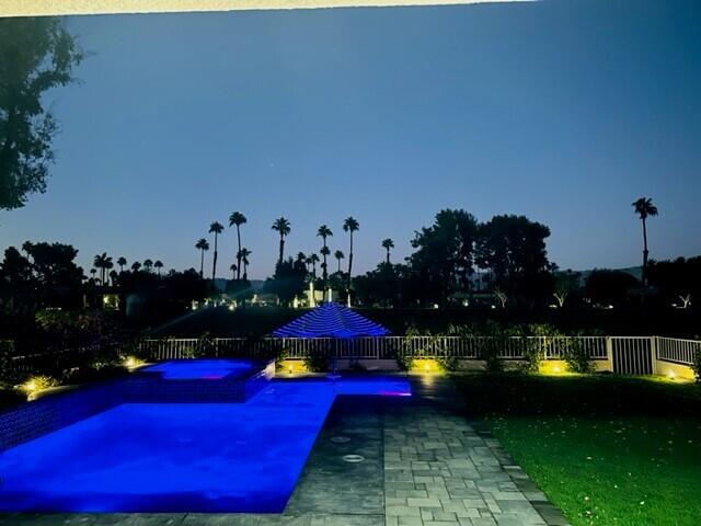 a view of swimming pool outdoor seating and living room