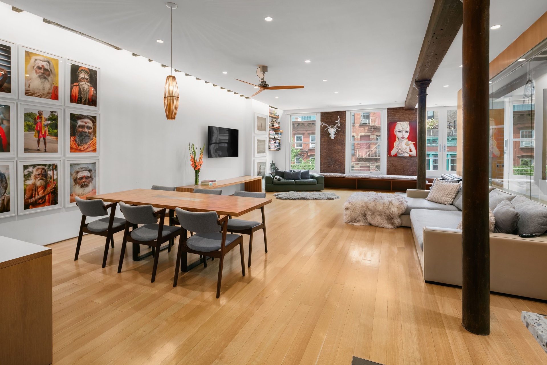 a view of a dining room with furniture and wooden floor