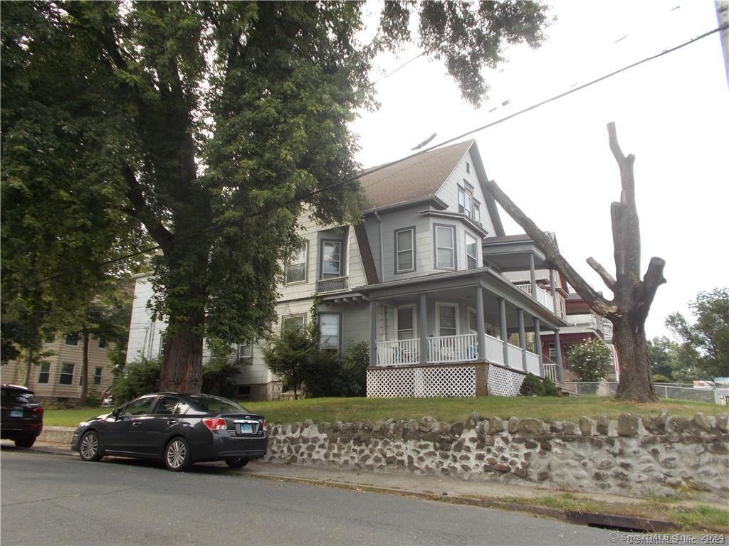 a view of a car parked in front of a house