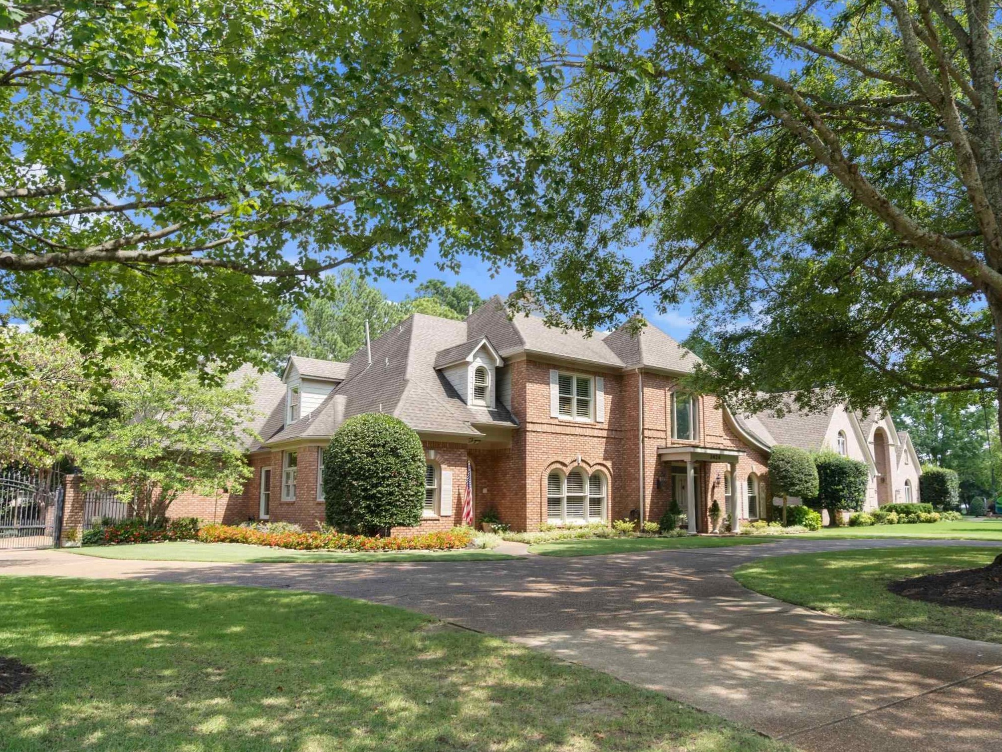 Front Elevation. Casement windows with arched brick accents