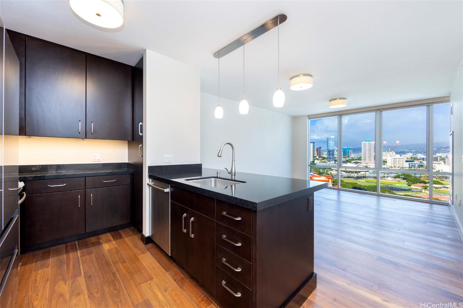 a kitchen with a sink and wooden cabinets