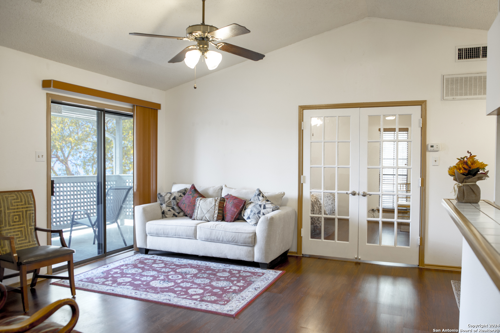 a living room with furniture and a window