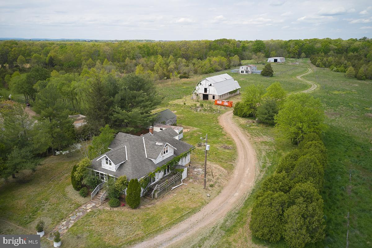 an aerial view of a house with a swimming pool