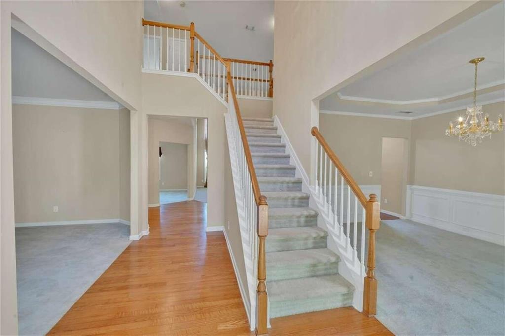 a view of a hallway view with staircase