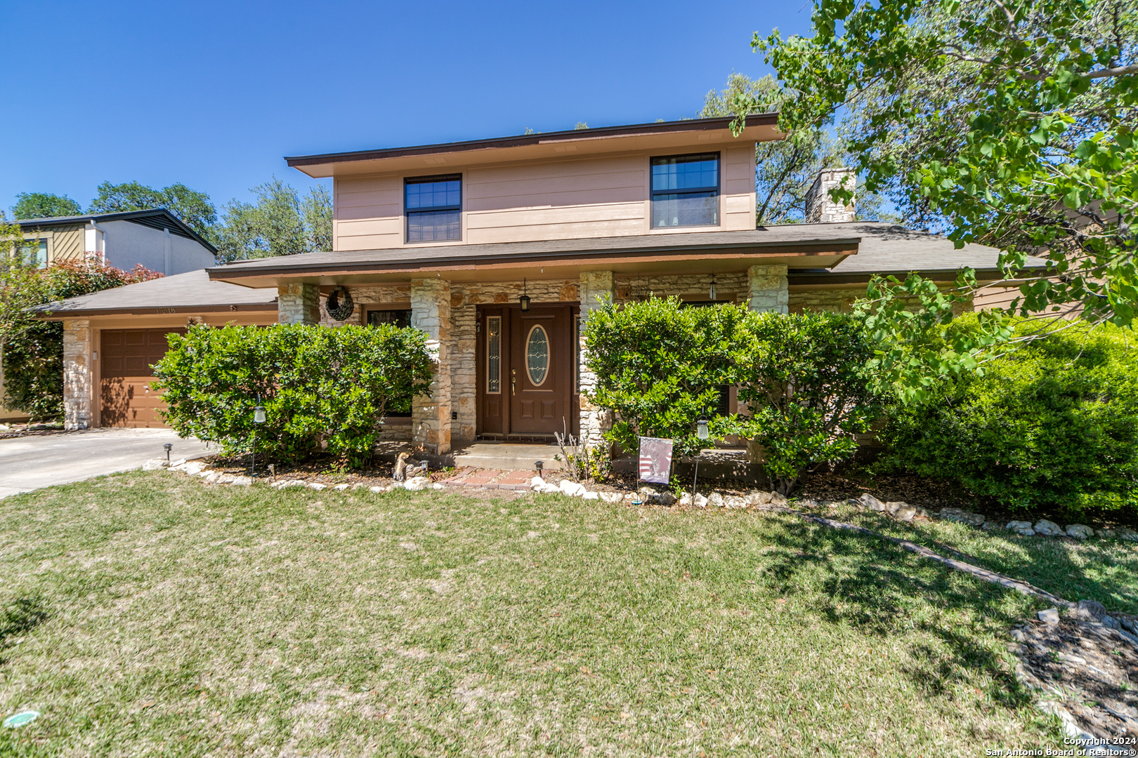 front view of a house with a yard