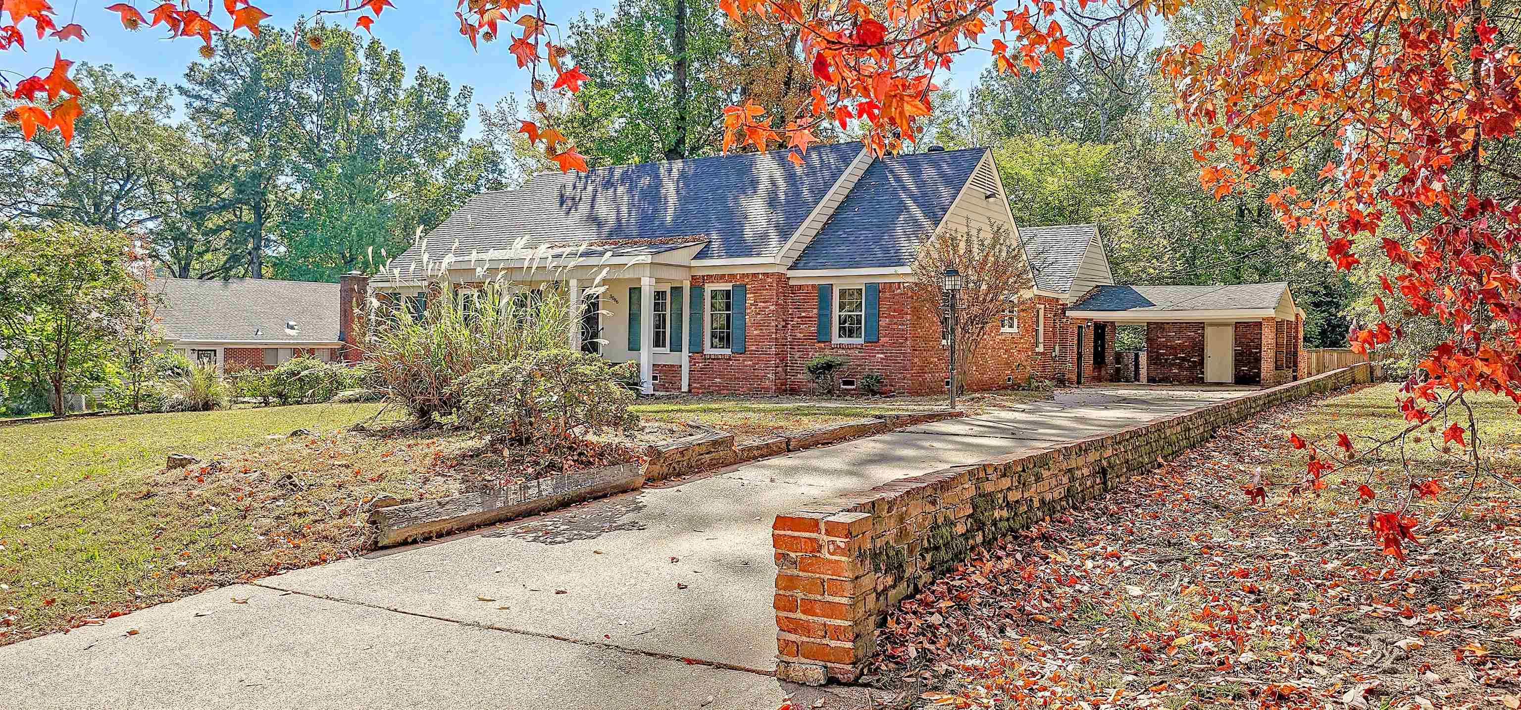 front view of a house with a yard