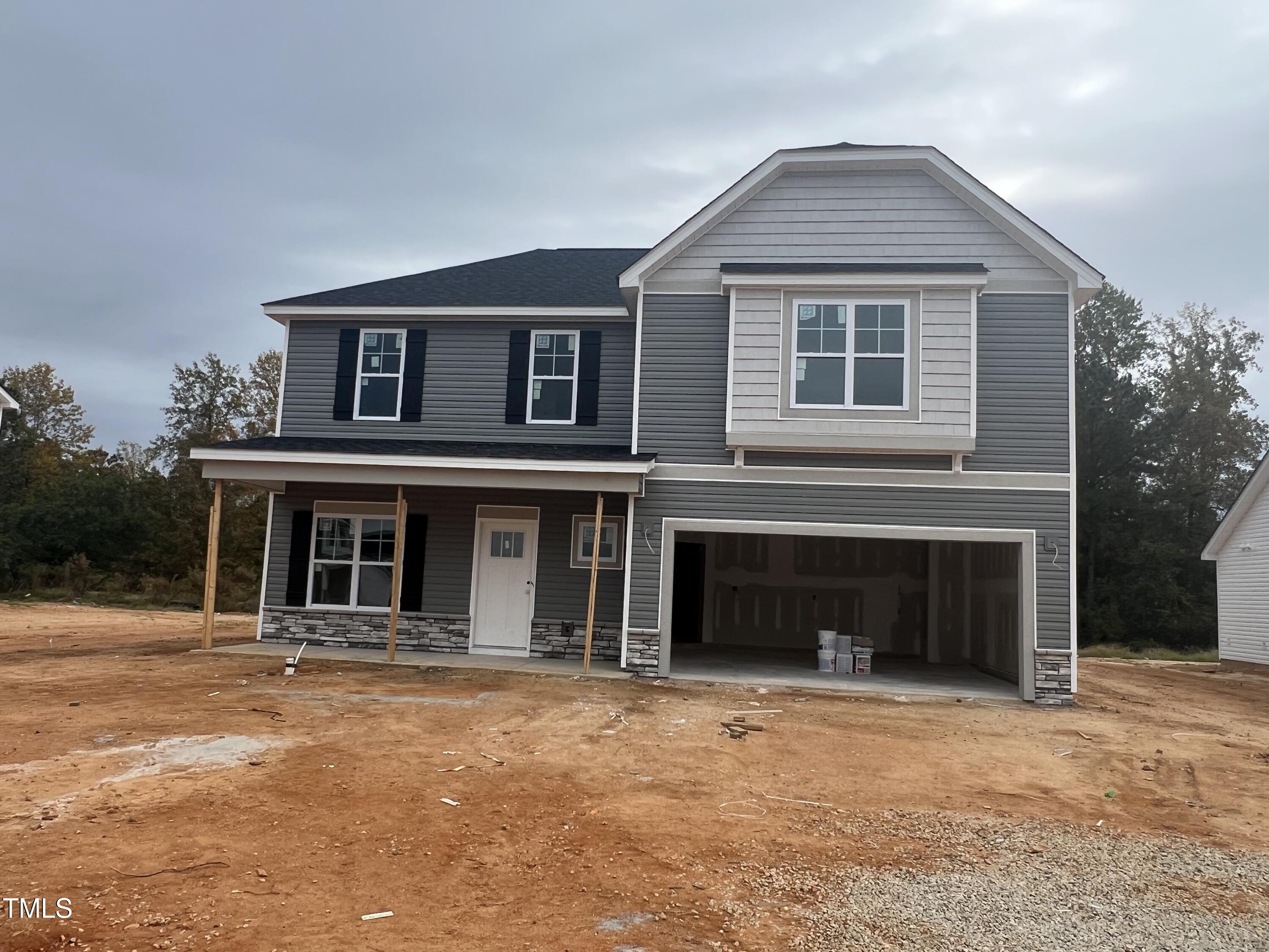 a front view of a house with a garage