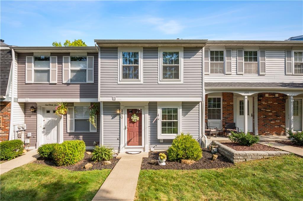 a front view of a house with a yard