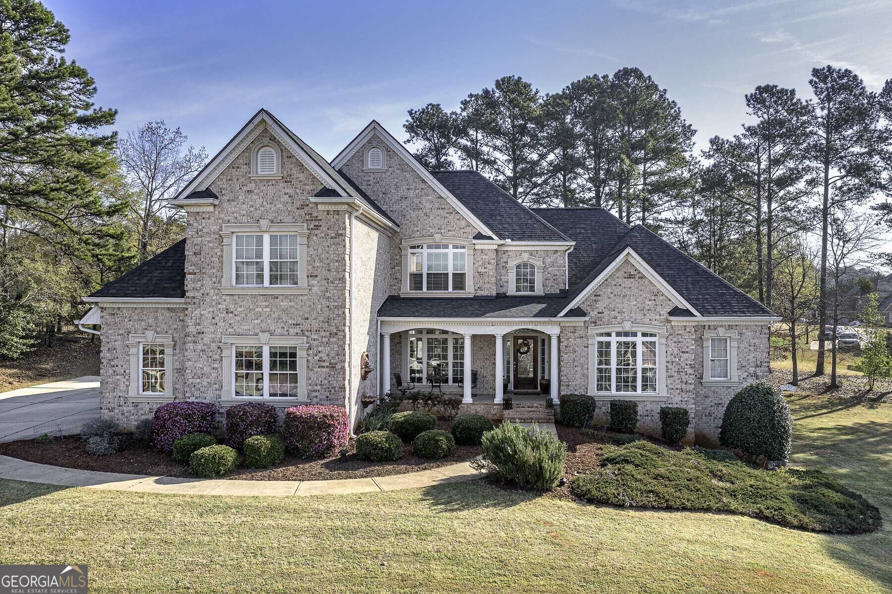 a front view of a house with a yard