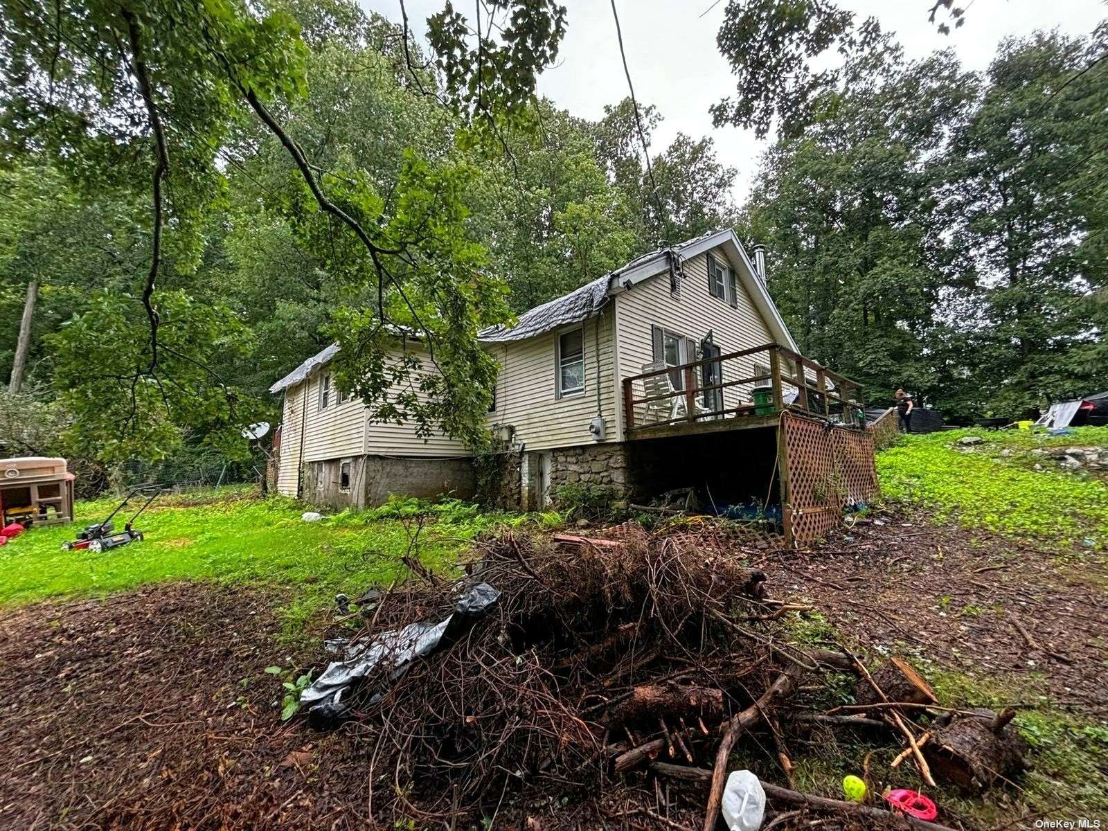 a front view of a house with a garden and yard