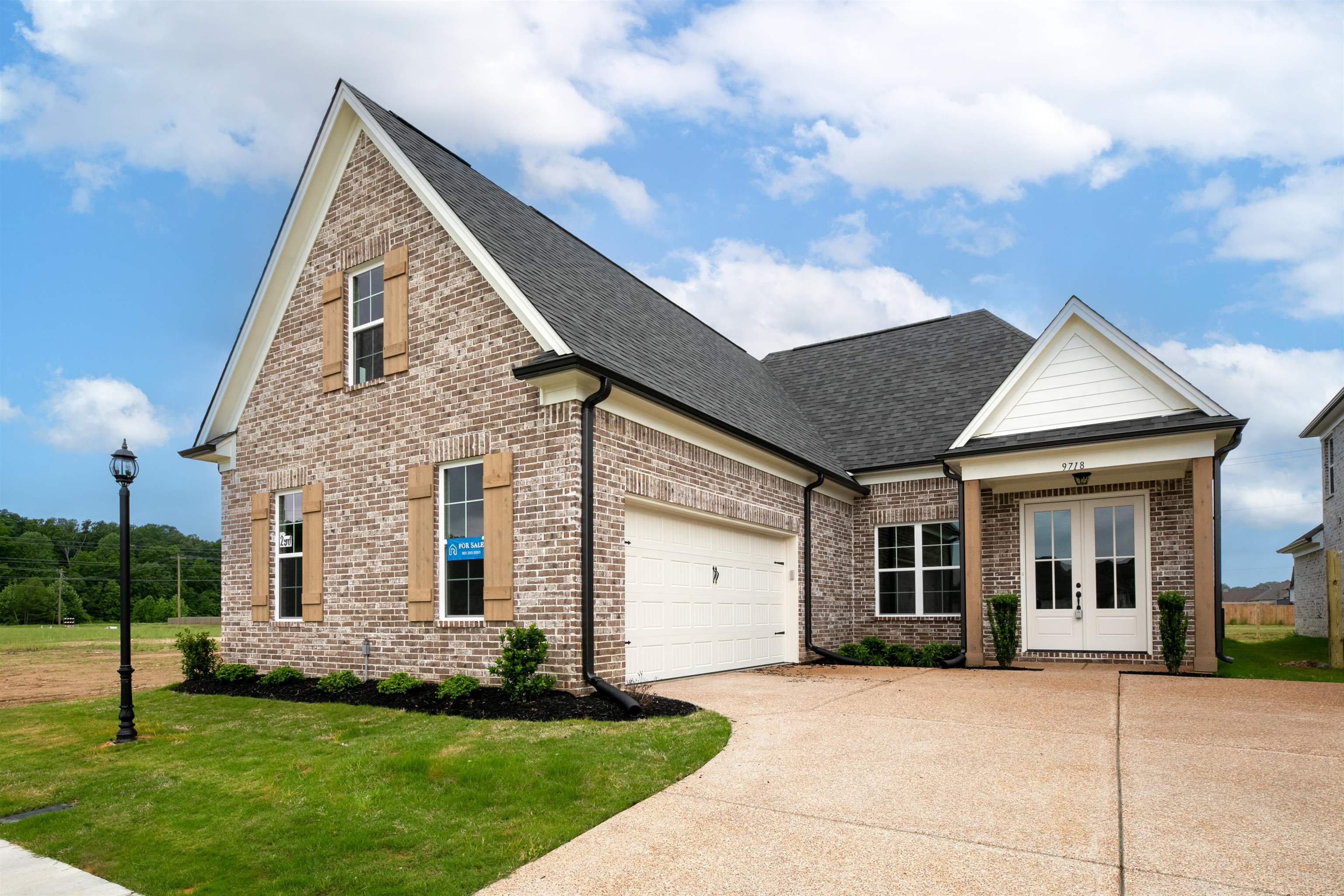 a view of house with a yard