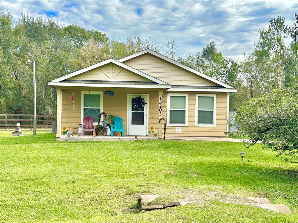 a view of a house with a yard patio and swimming pool