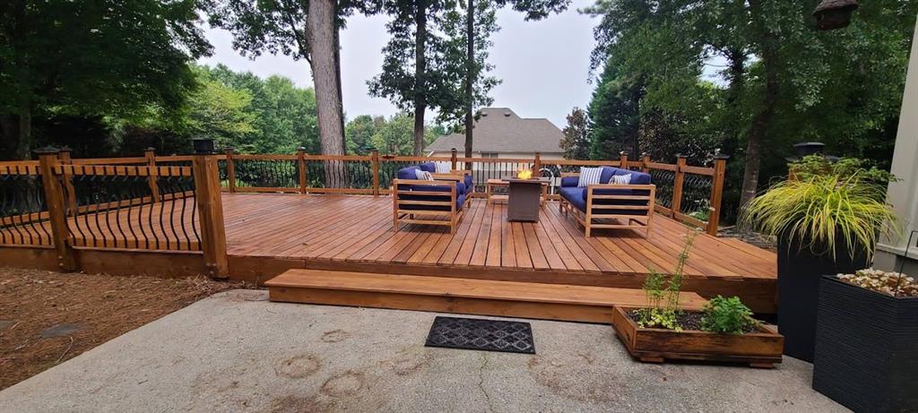 a view of a chairs and table in the patio