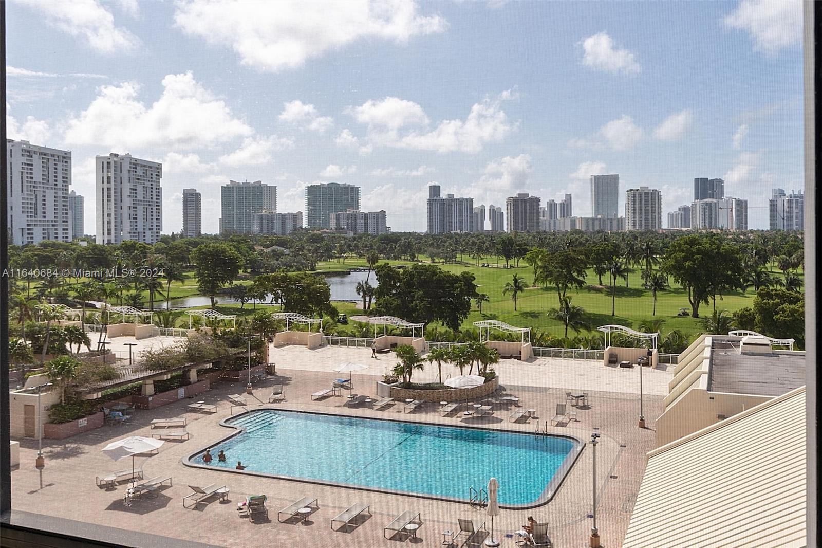 a view of a swimming pool and a chairs