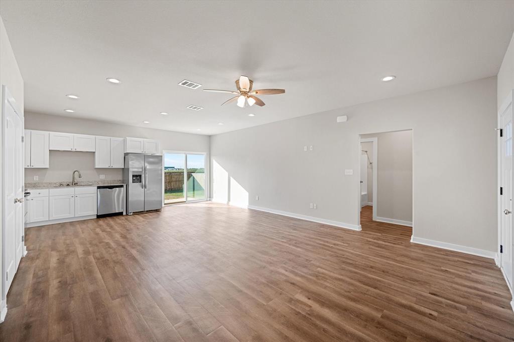 a view of kitchen and wooden floor