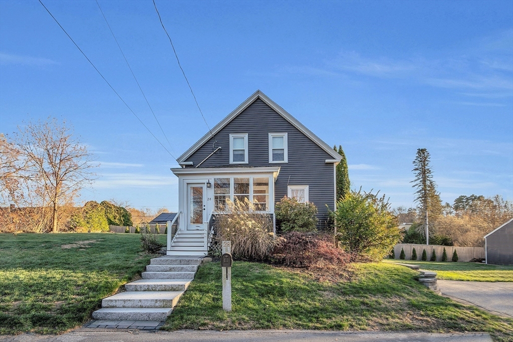 a front view of a house with a yard