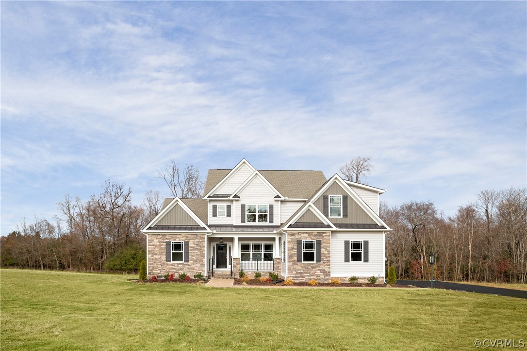 a front view of a house with a garden and swimming pool