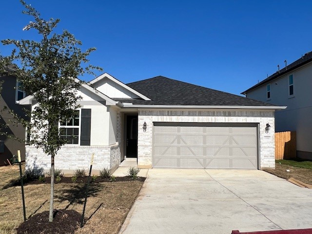 a front view of a house with a garage