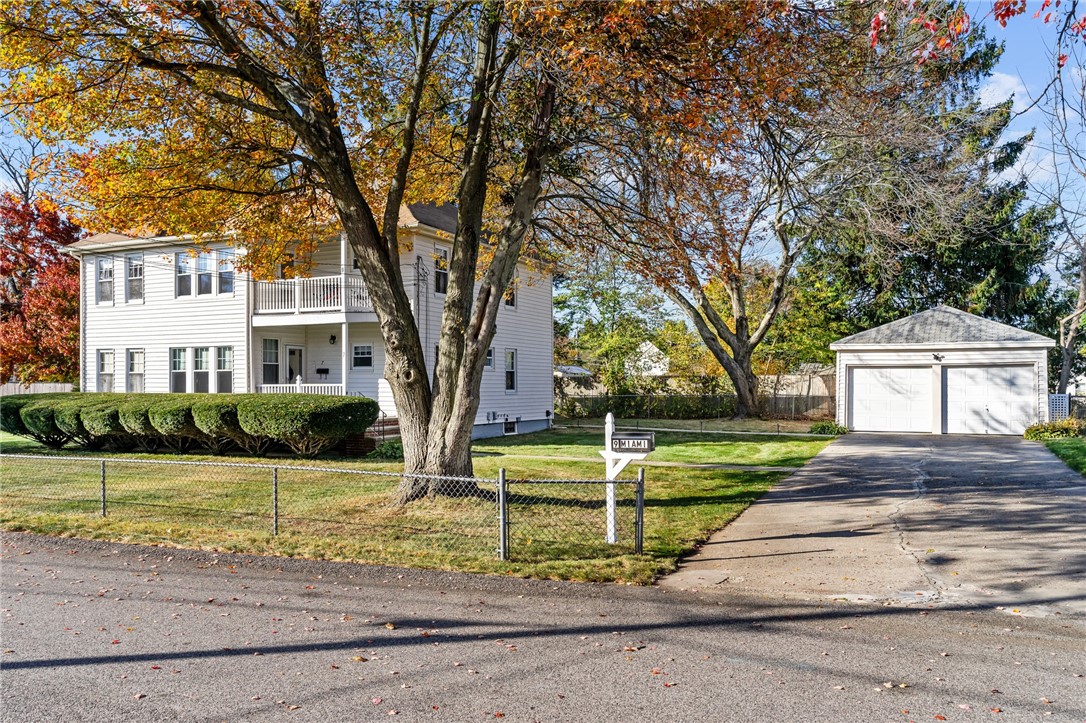 Exterior front with driveway and garage