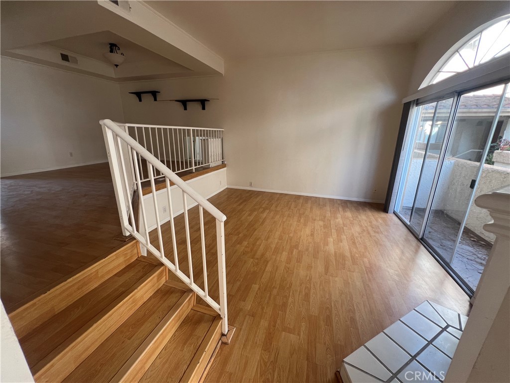 a view of entryway with wooden floor