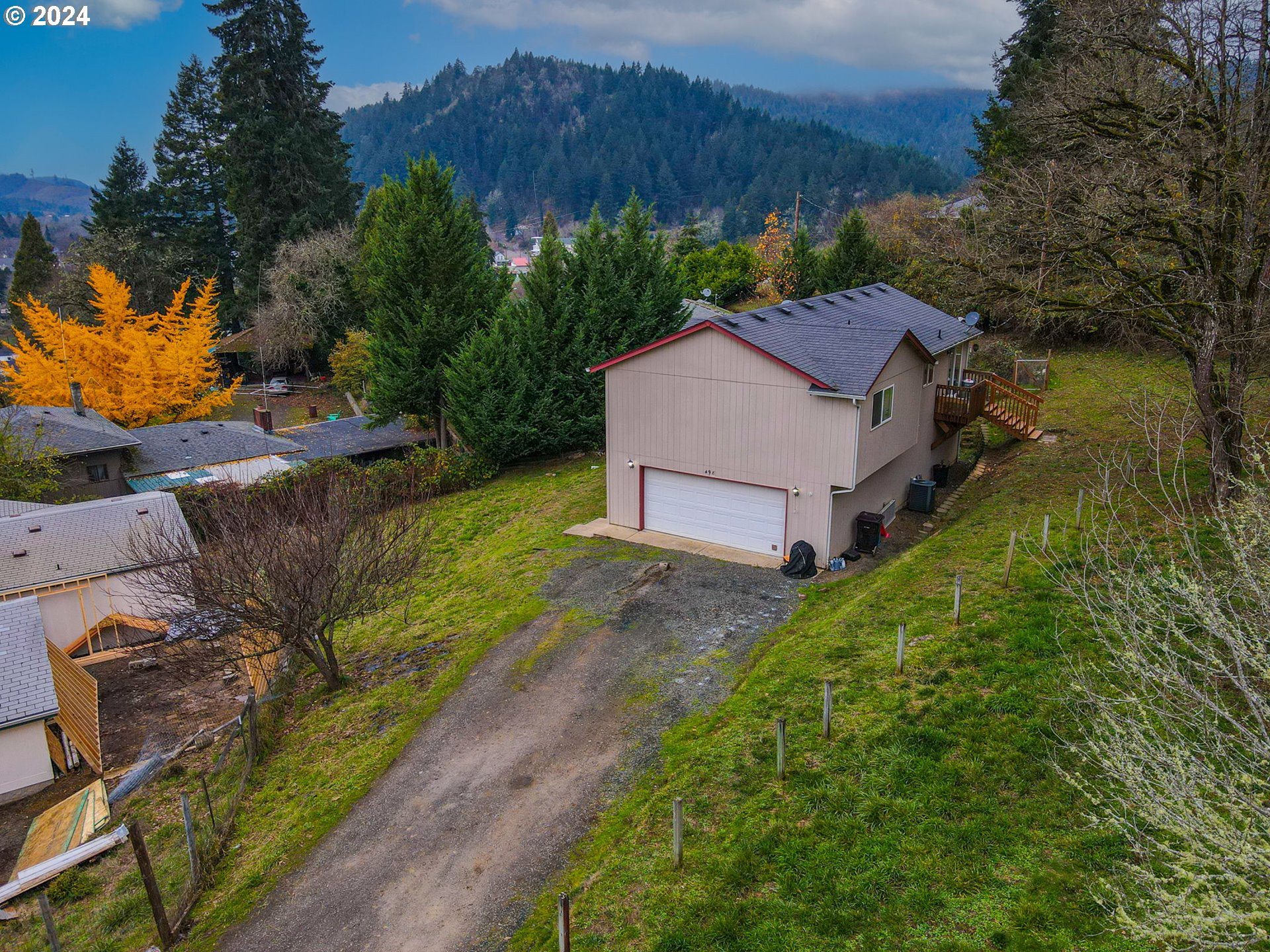 a aerial view of a house with a yard