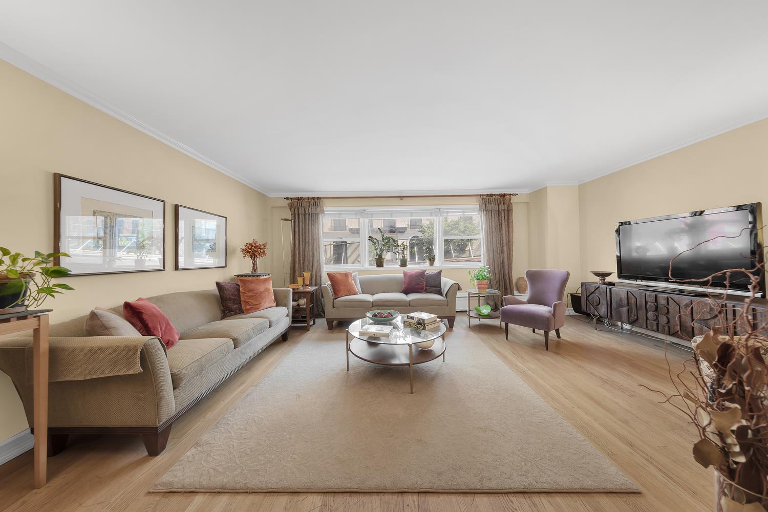 a living room with furniture and a flat screen tv