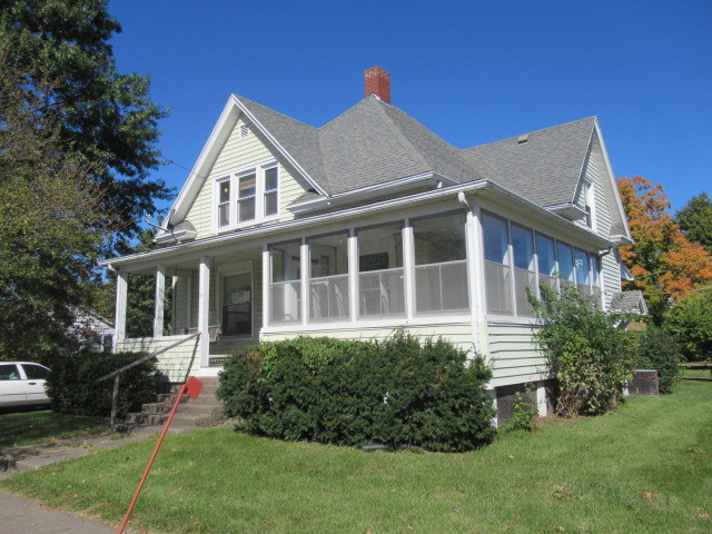 a view of a house with a yard and plants