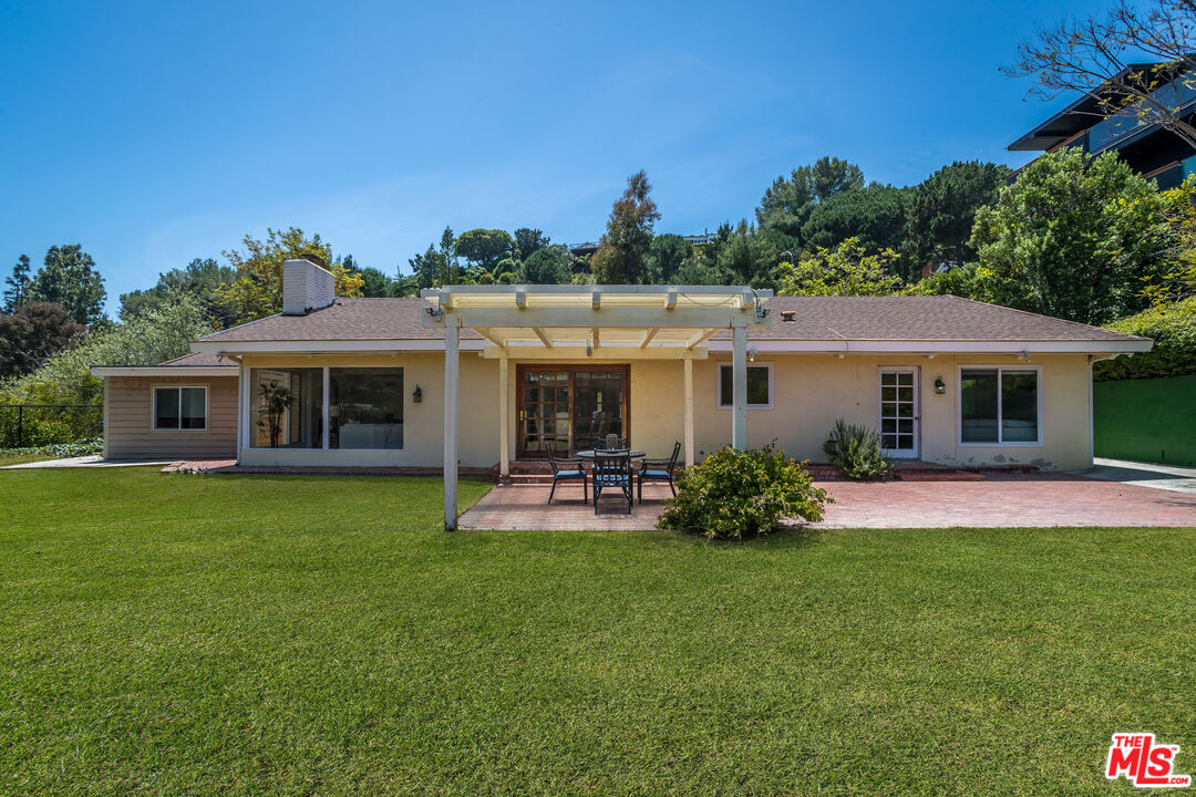 a front view of a house with a garden and porch