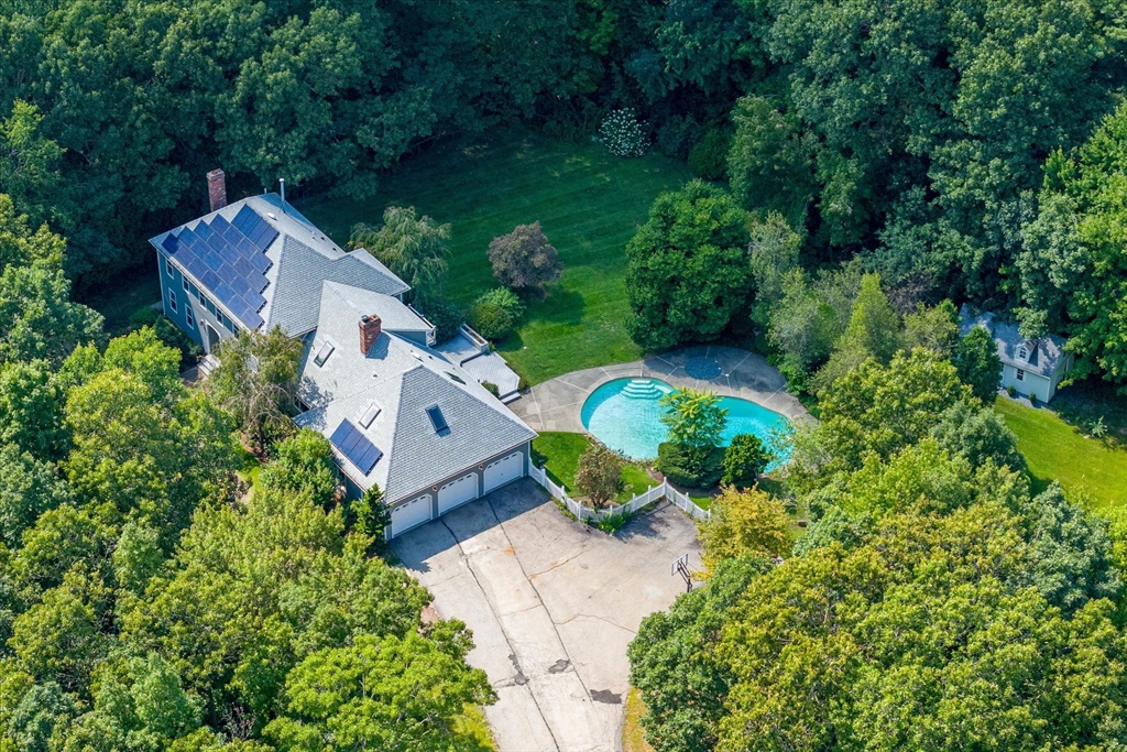 an aerial view of a house with a garden