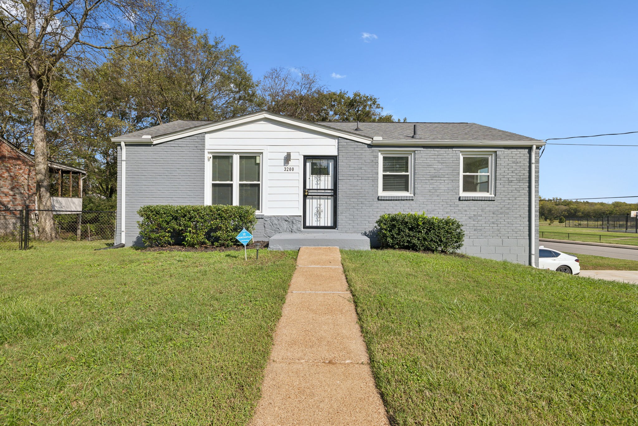 a view of a house with a yard