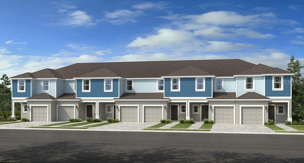 a front view of residential houses with street