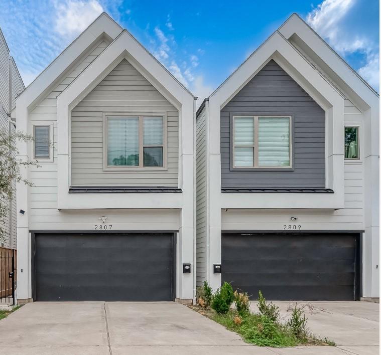 a front view of a house with garage