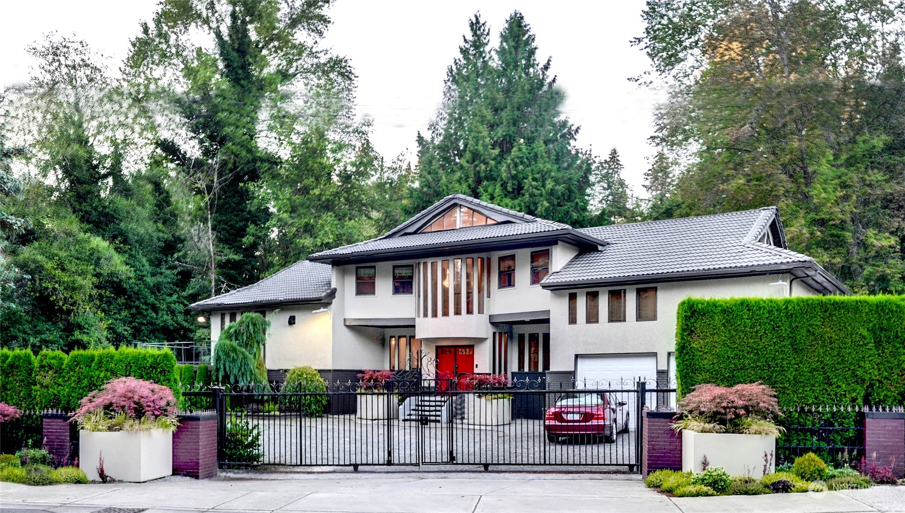 a front view of a house with garden