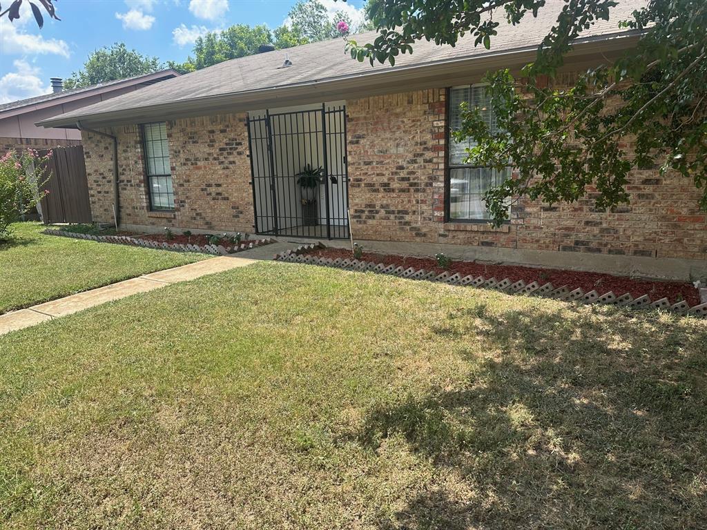 front view of a house with a yard