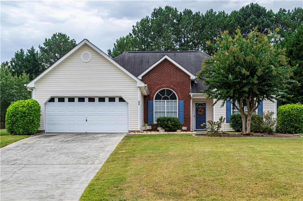 a front view of a house with a yard