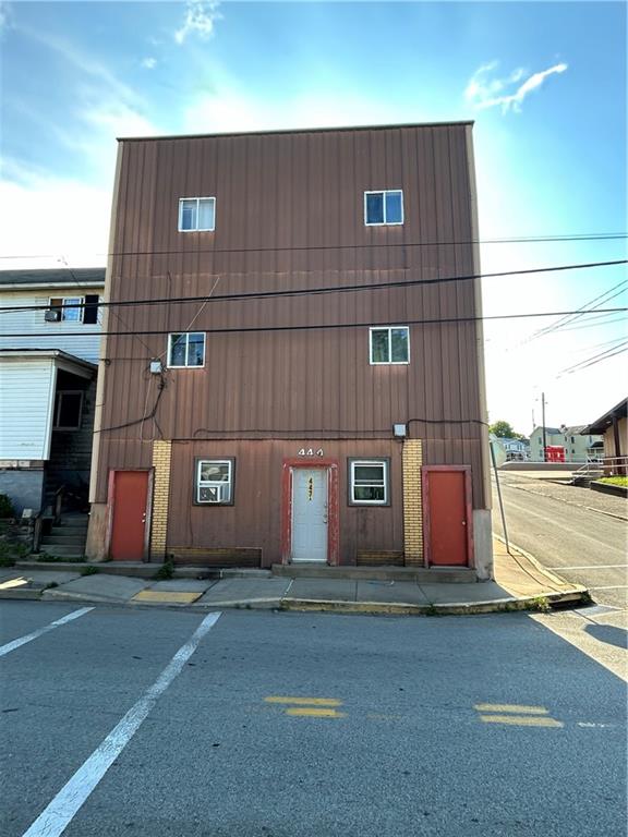 a front view of a building with bridge