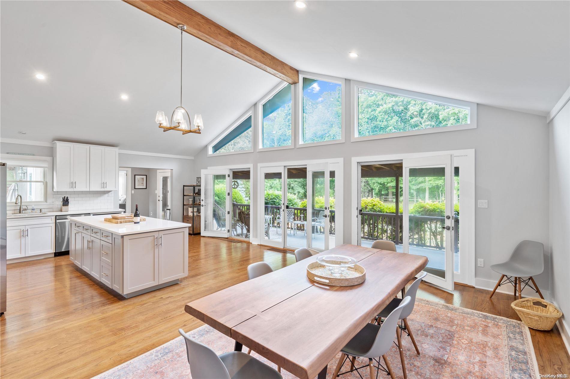 a living room with kitchen island furniture and a large window