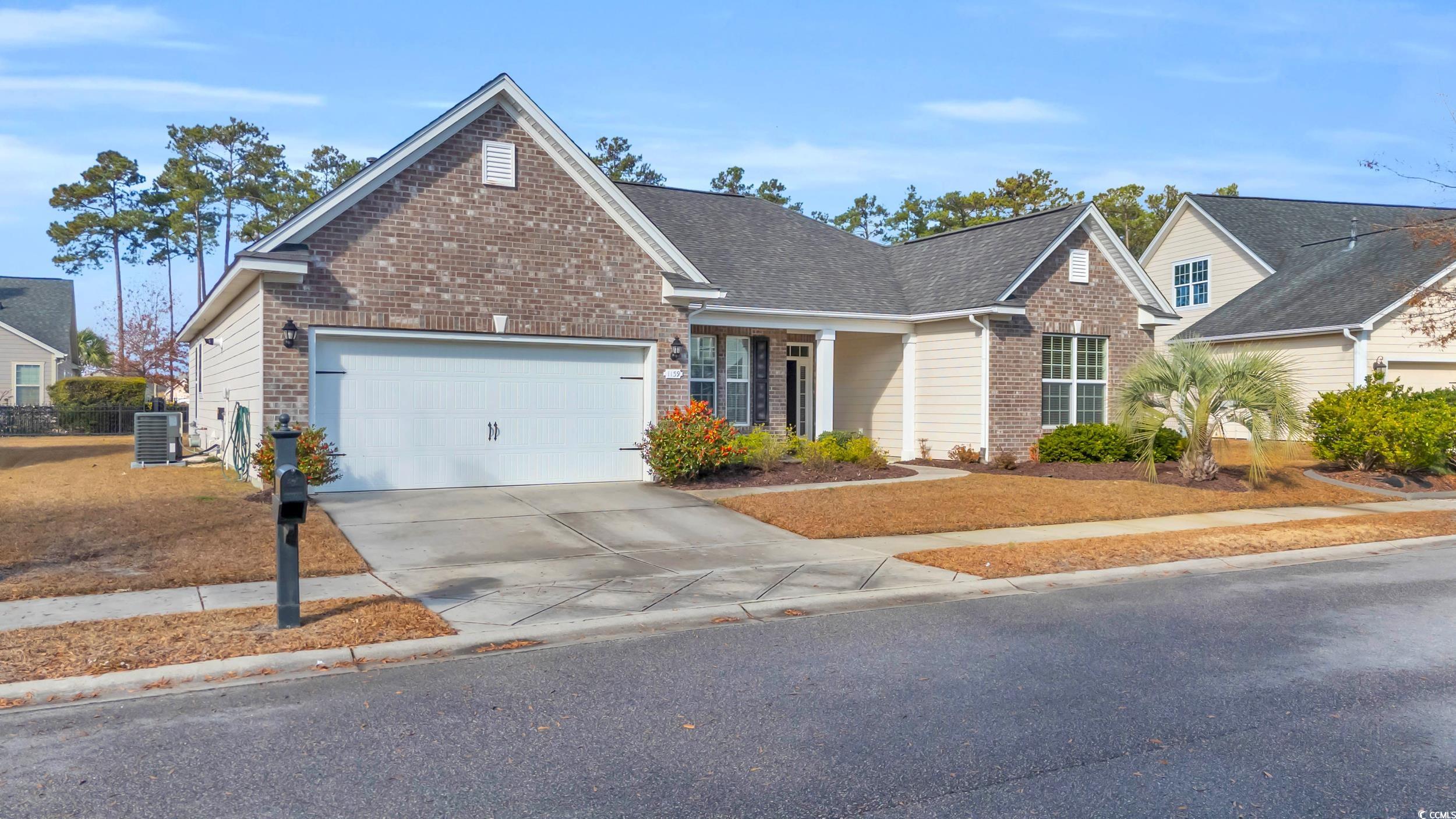 View of front of property with central AC unit and