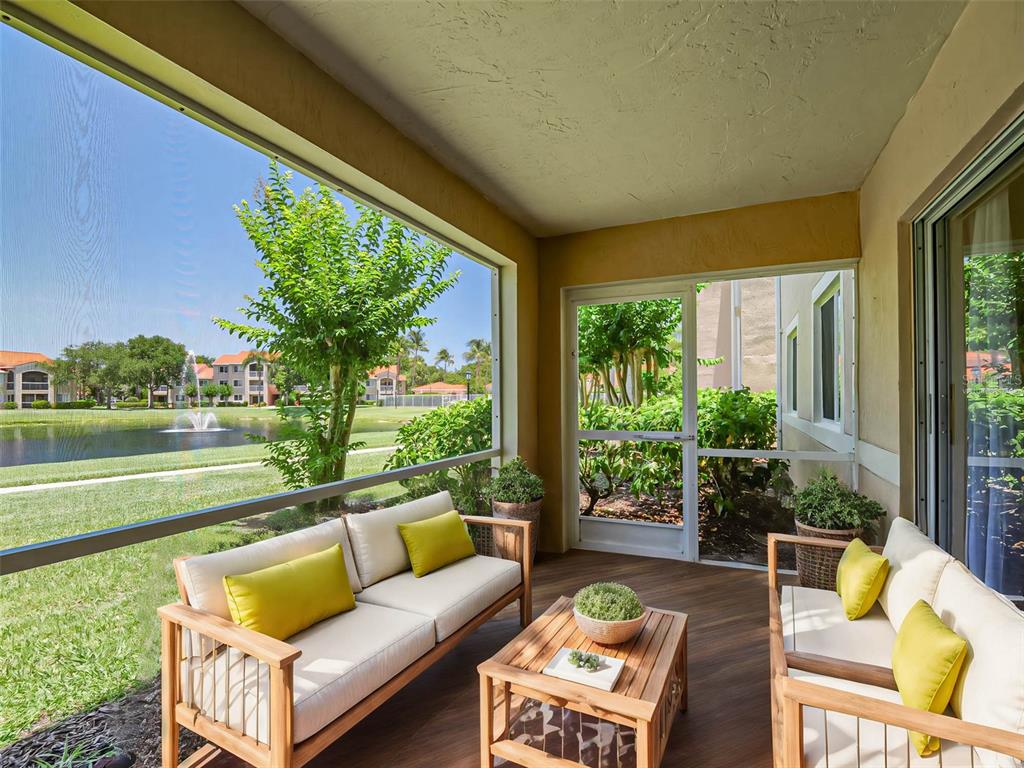 a view of a patio with couches chairs and a table