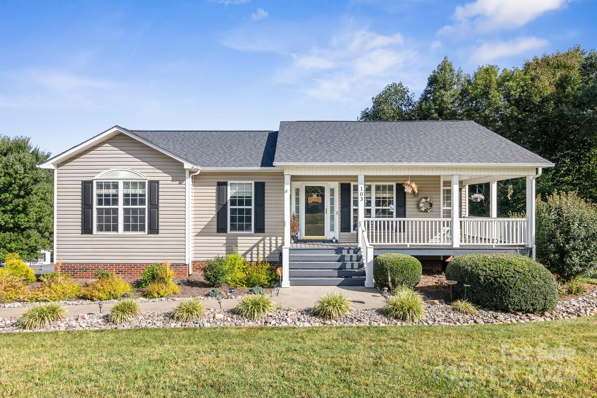 front view of a house with a yard