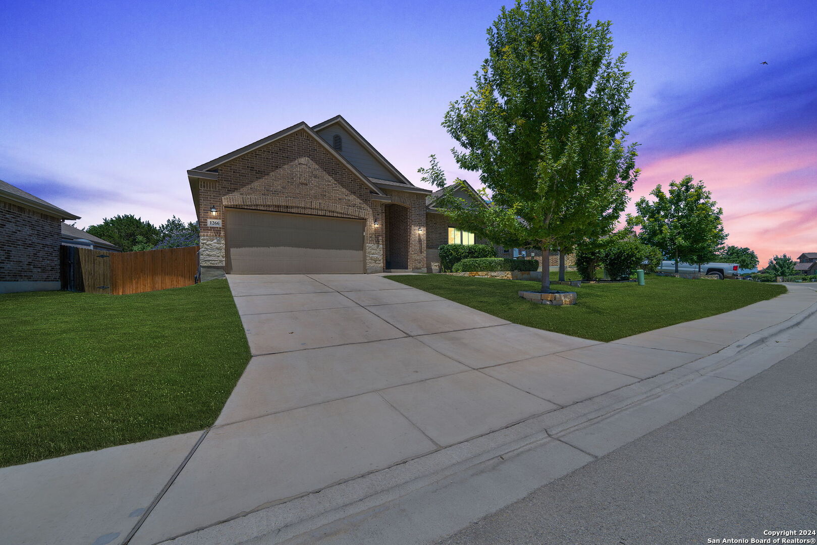 a front view of a house with yard