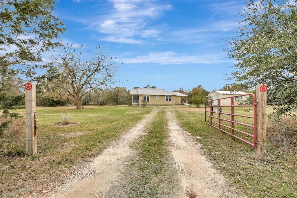 Welcome to your charming retreat! This historic home is nestled on 2.069 peaceful acres, featuring fresh exterior paint (2024), a cozy screened-in front porch, and a beautifully maintained yard with newly planted shumard oaks and Texas sages.