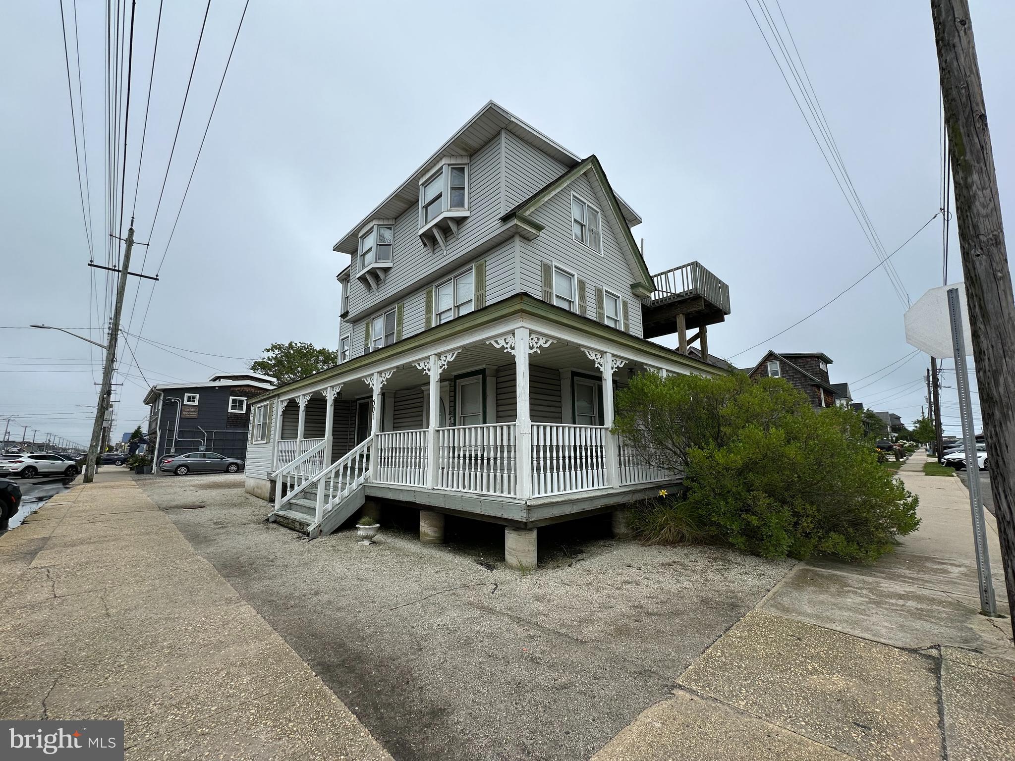 a view of a house with a wooden deck