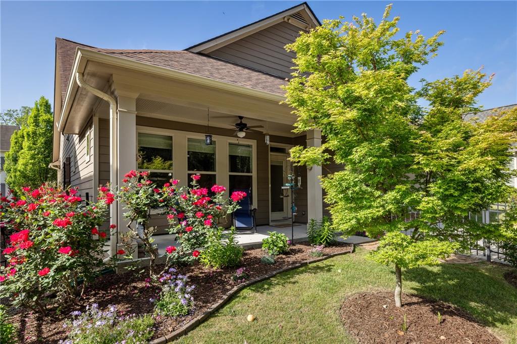 a view of a house with a flower garden