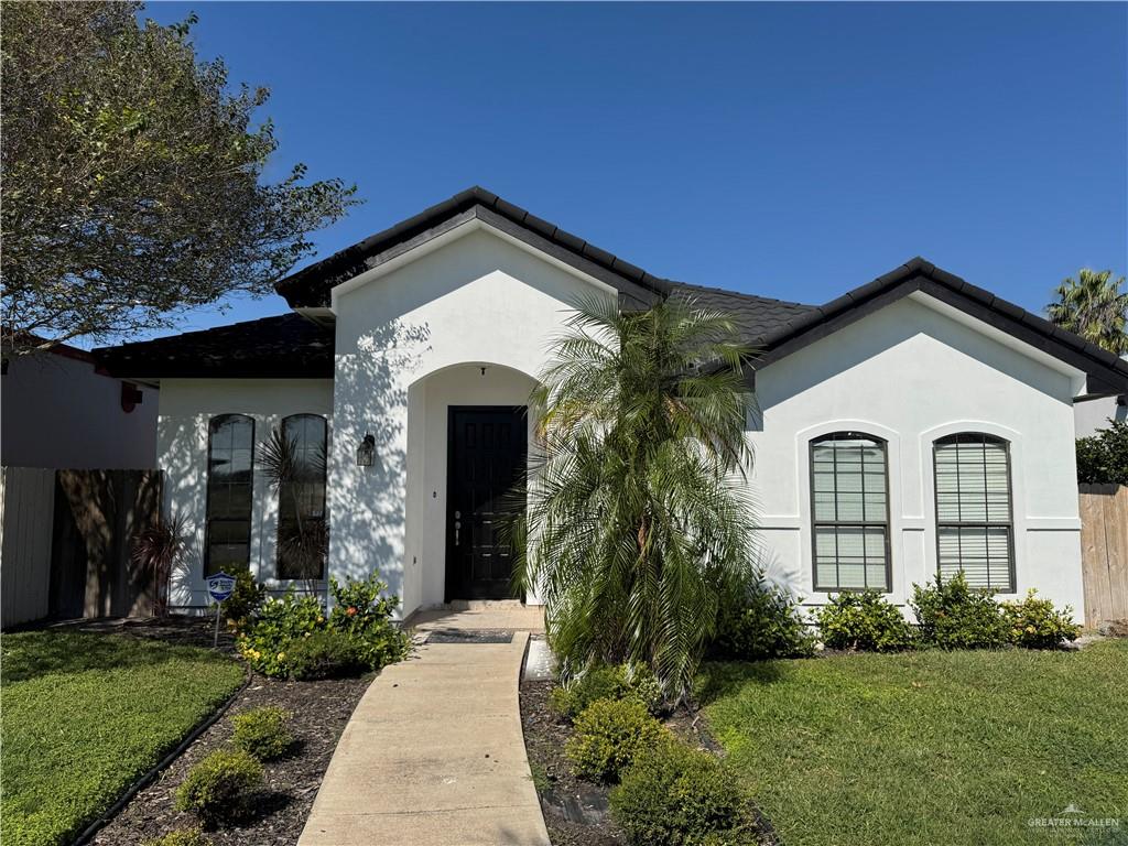 View of front of house with a front yard