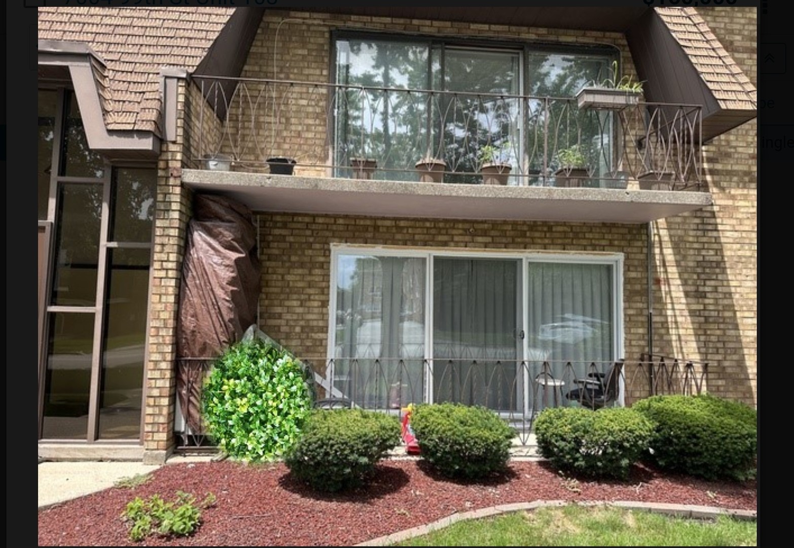 a view of a house with a garden