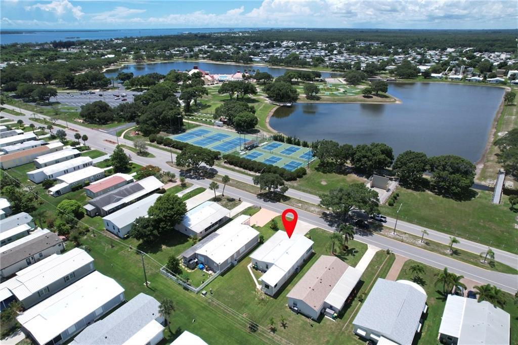 an aerial view of a house with a lake view