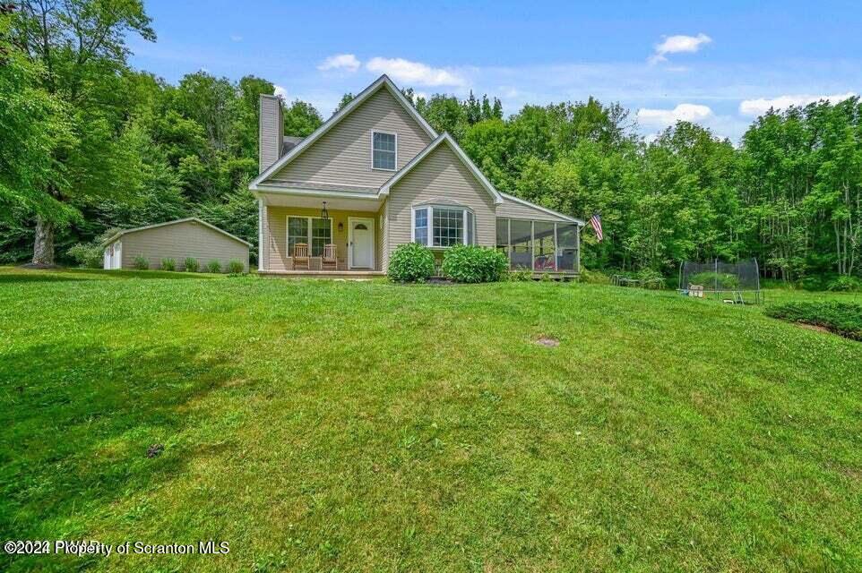 a front of a house with a garden